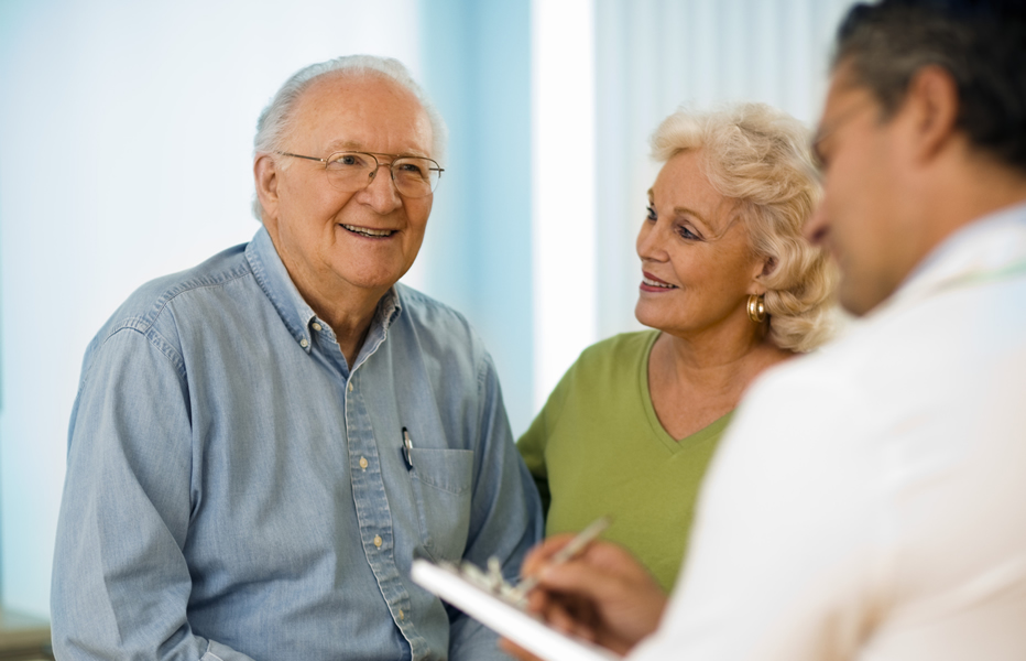Smiling couple talking with provider
