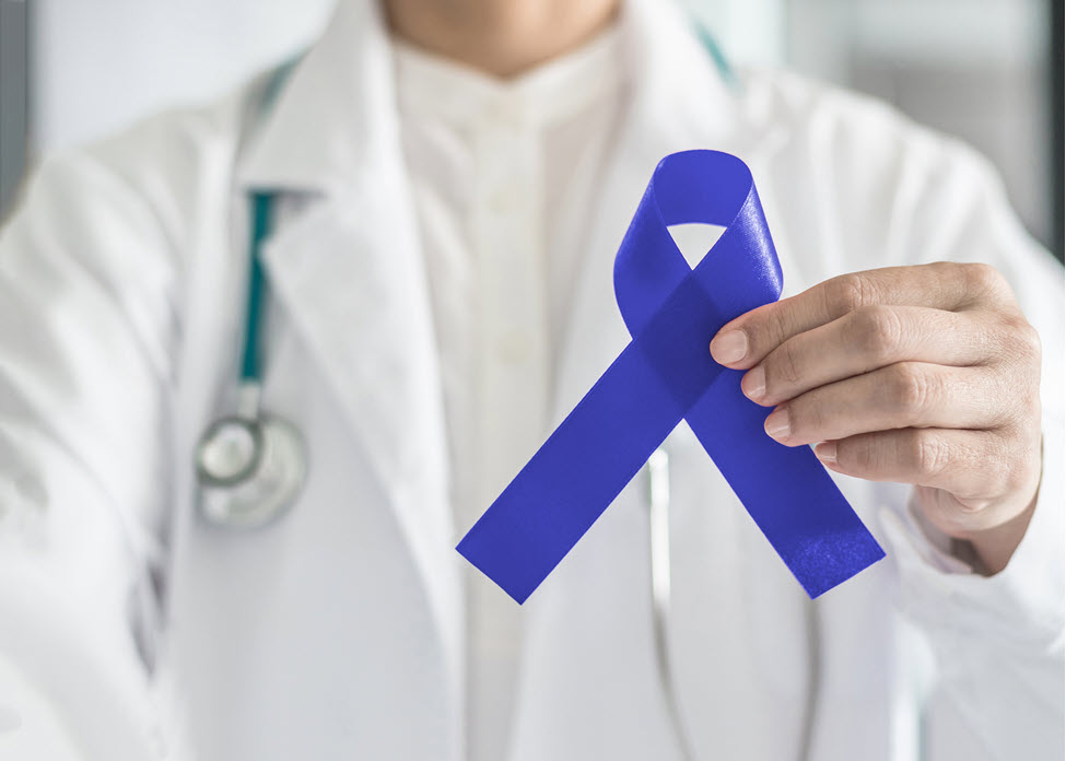 Provider holding blue ribbon  